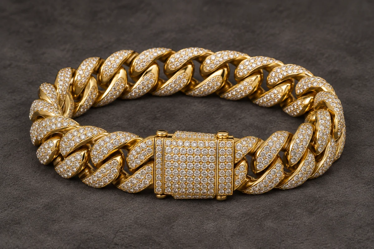 Illustration of a heavy yellow-gold Cuban-link bracelet with pavé diamonds and a substantial box clasp