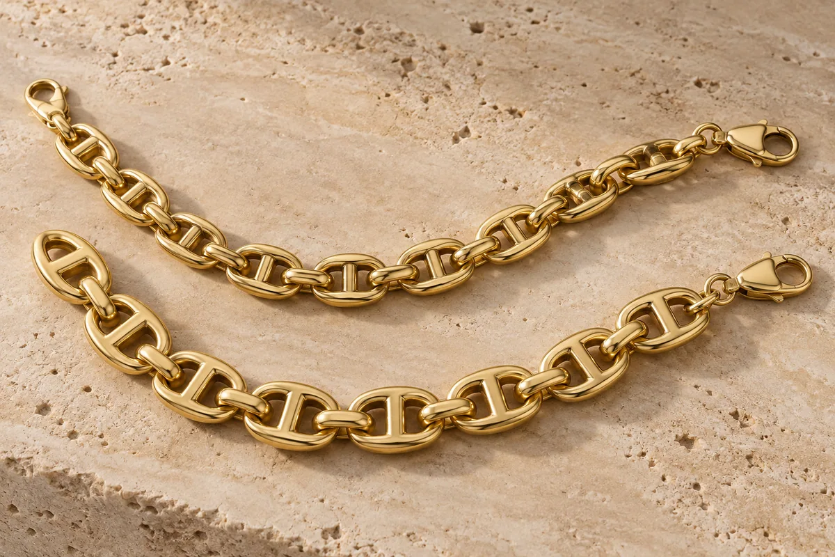 Substantial gold mariner-link bracelet and chain on pale stone