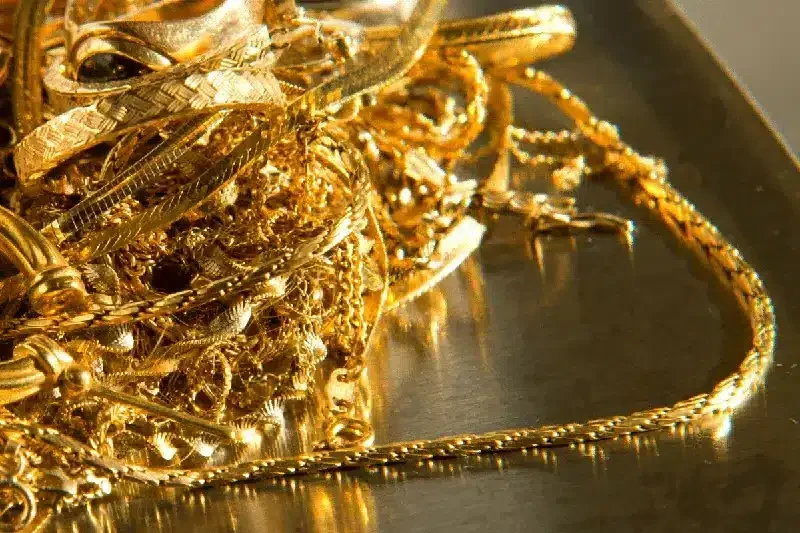 A collection of worn gold jewelry and scrap pieces