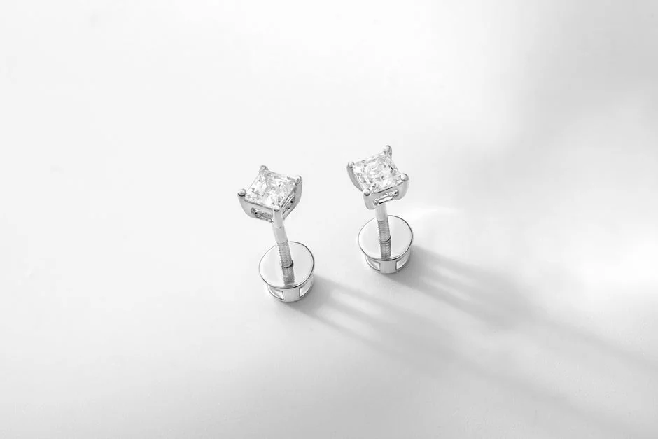 A pair of substantial round diamond stud earrings